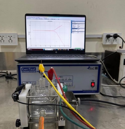 Electrochemical corrosion cell connected to a CorrTest instrument showing a Tafel plot