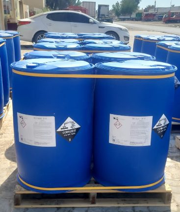 Labelled blue chemical drums on a pallet