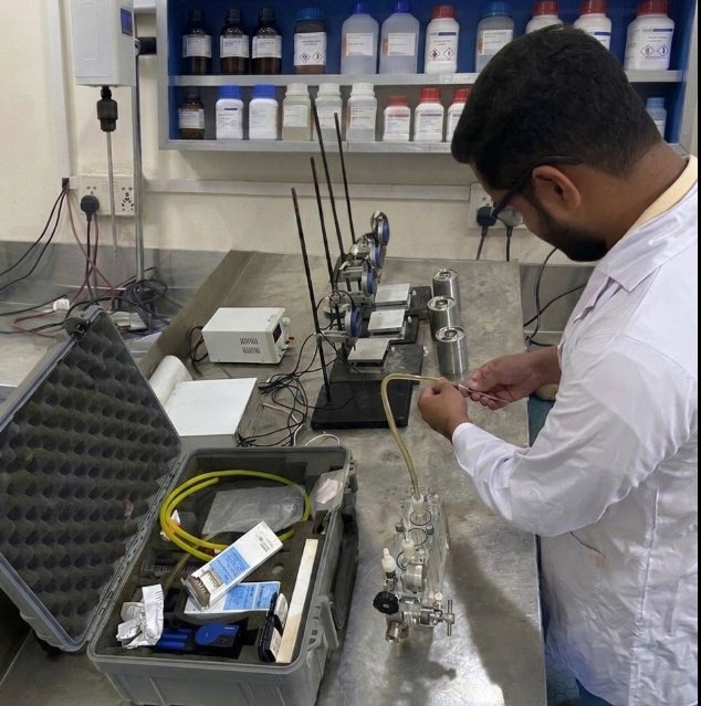 Redox chemist setting up a Garrett Gas Train for H2S testing