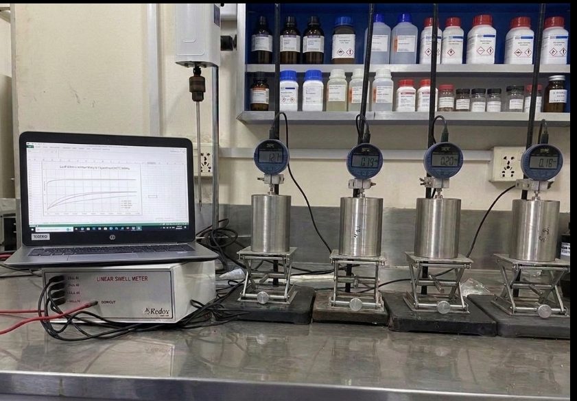 Four-cell Linear Swell Meter with digital gauges connected to a laptop