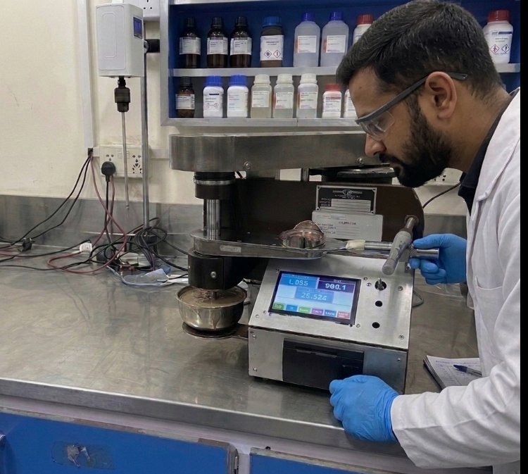 Redox chemist running a lubricity test on the lubricity tester